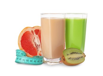 Photo of Tasty shakes, half of grapefruit, kiwi and measuring tape isolated on white. Weight loss