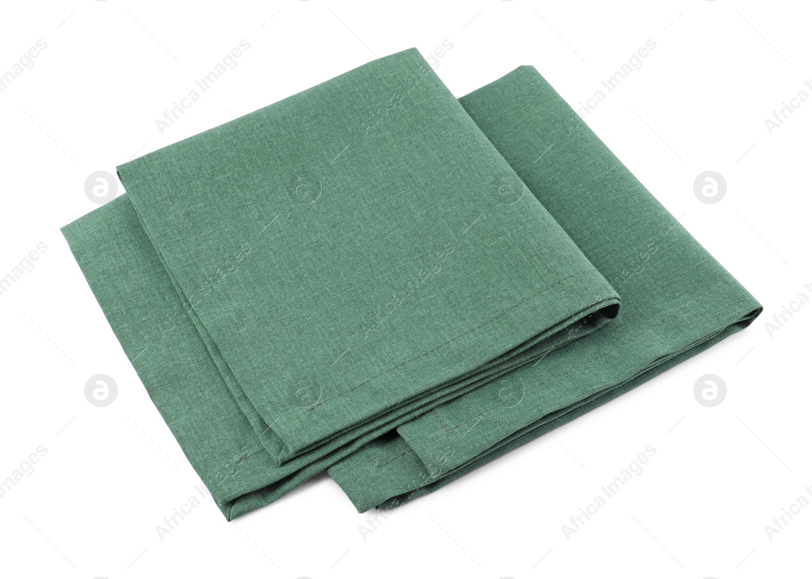 Photo of Green cloth kitchen napkins isolated on white