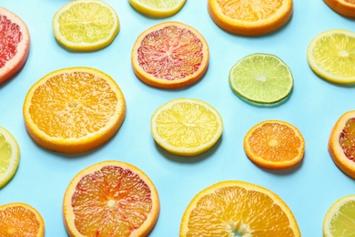 Different citrus fruits on color background, closeup