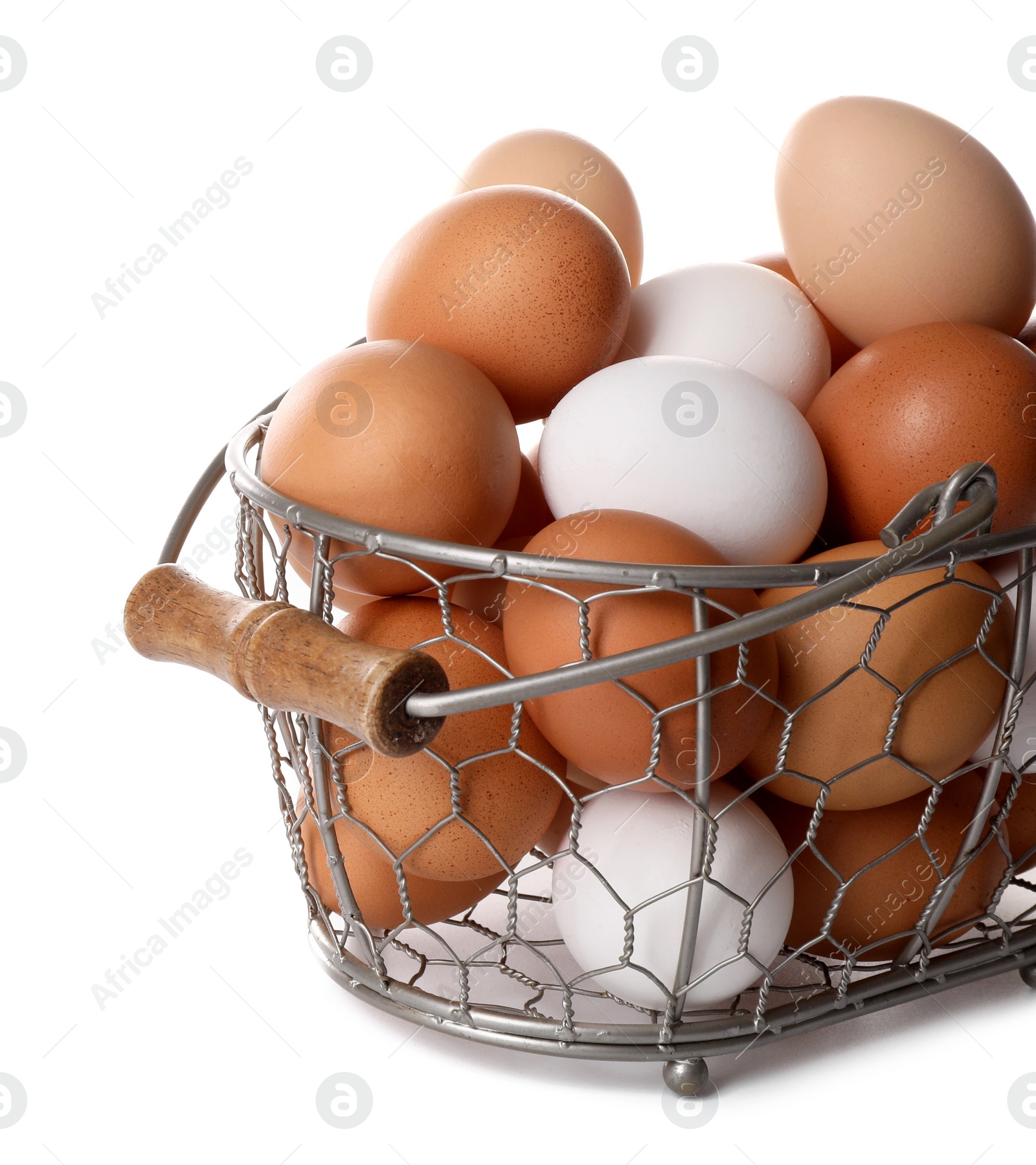 Photo of Fresh chicken eggs in metal basket isolated on white