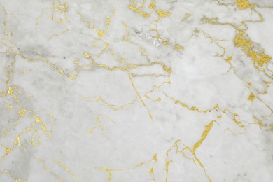 Image of Beautiful light gray and gold marble surface as background
