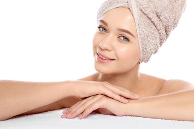 Photo of Portrait of young pretty woman with towel on white background