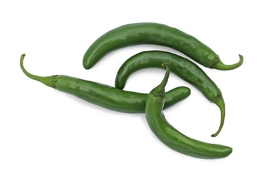 Green hot chili peppers on white background, top view