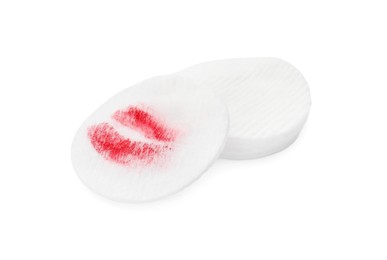 Photo of Clean and dirty cotton pads after removing makeup on white background
