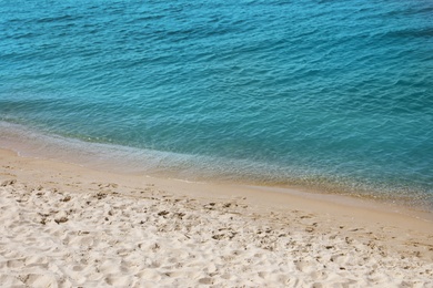 Photo of Sandy beach near sea on sunny day