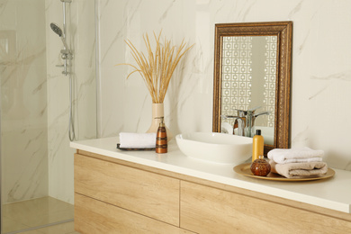 Photo of Vintage mirror and vessel sink in stylish bathroom
