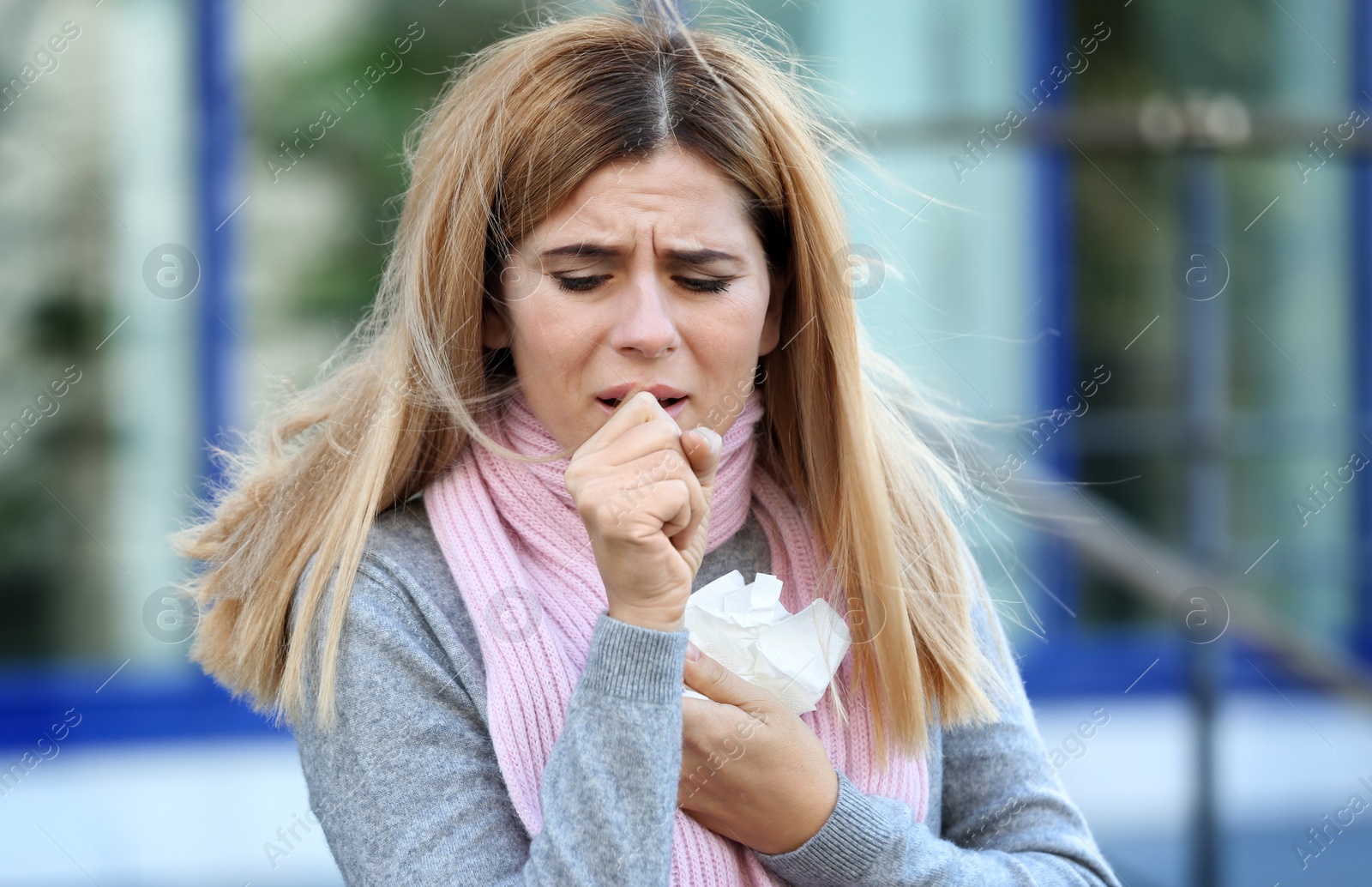 Photo of Woman suffering from cough and cold outdoors