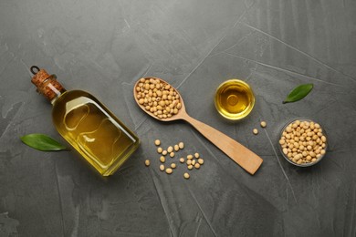 Flat lay composition with soybean oil on grey table