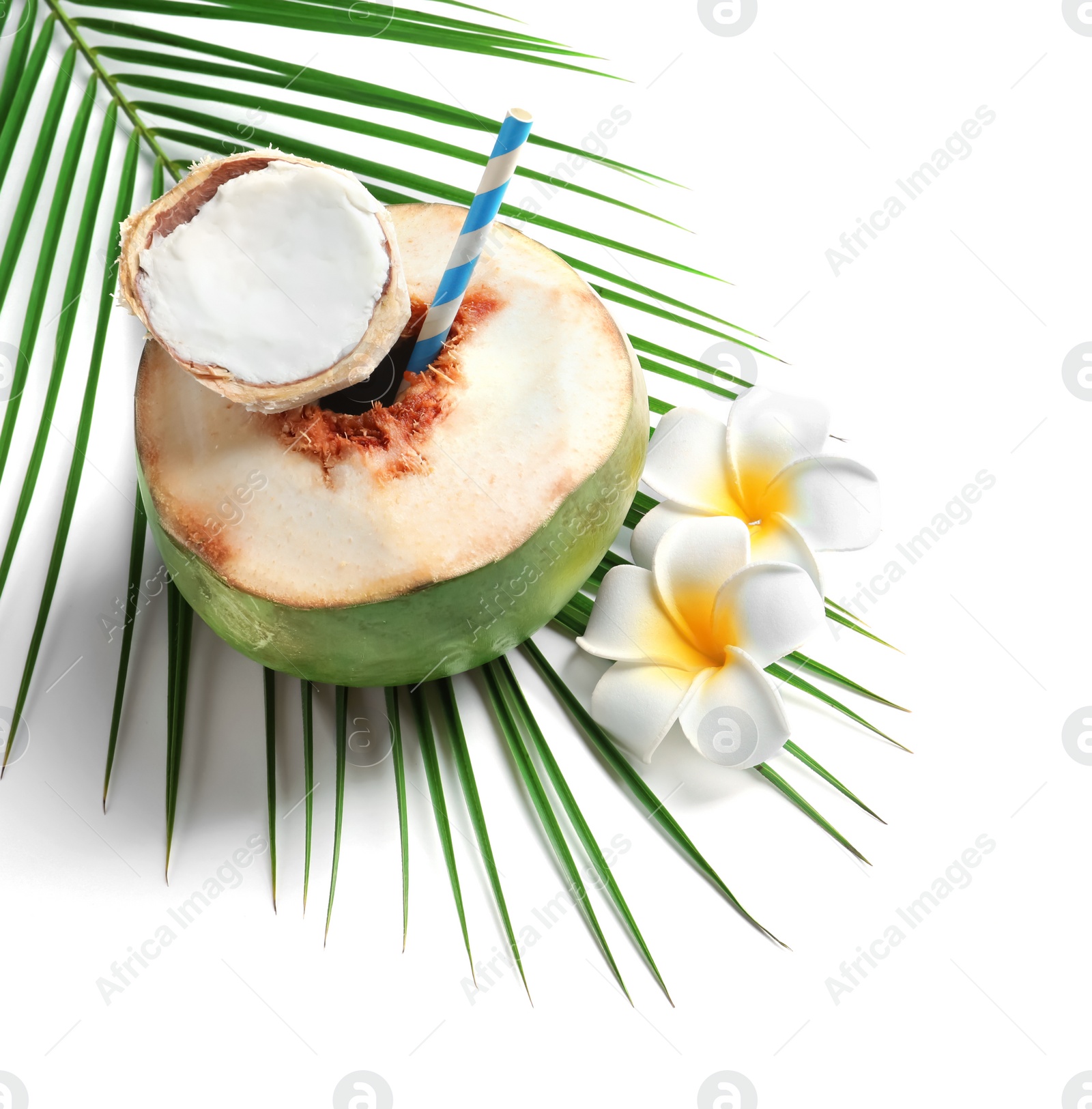 Photo of Fresh green coconut with drinking straw and flowers on white background