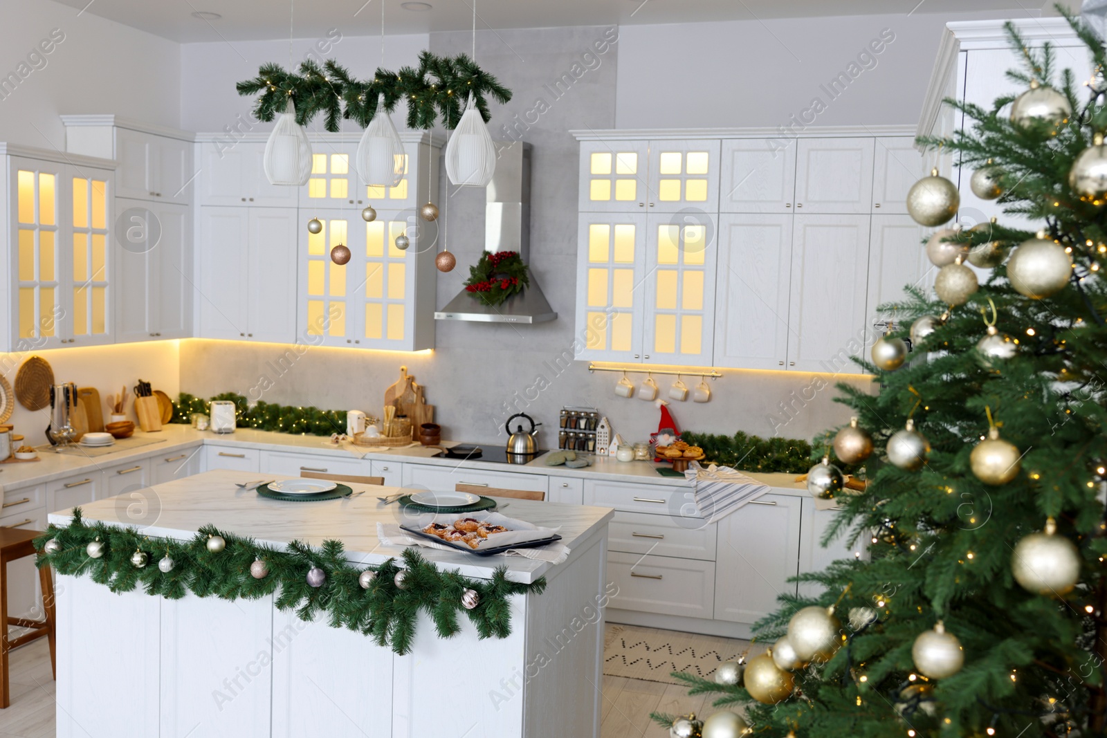 Photo of Cozy spacious kitchen decorated for Christmas. Interior design