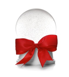 Photo of Beautiful Christmas snow globe with red bow knot on white background