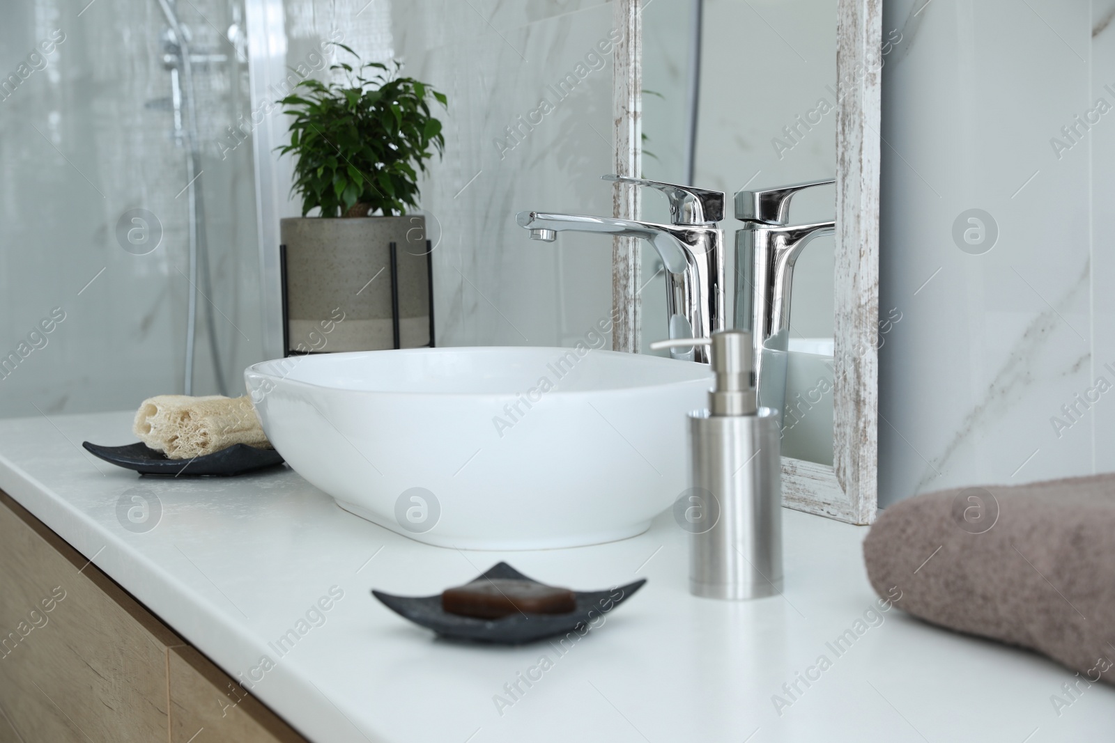 Photo of Modern bathroom interior with stylish mirror and vessel sink