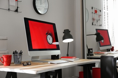 Photo of Modern computer on desk in room. Home workplace