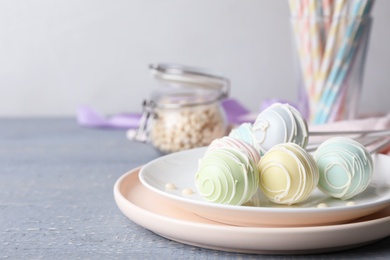 Photo of Sweet cake pops on grey wooden table. Space for text