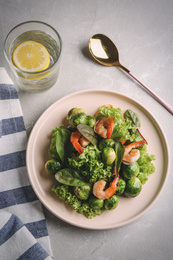 Tasty salad with Brussels sprouts served on light grey table, flat lay. Food photography  