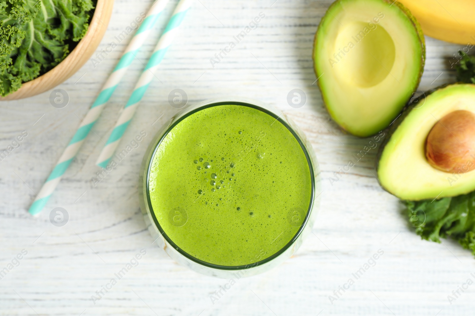 Photo of Flat lay composition with kale smoothie on white wooden table