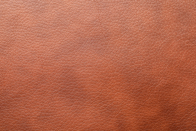 Texture of brown leather as background, closeup