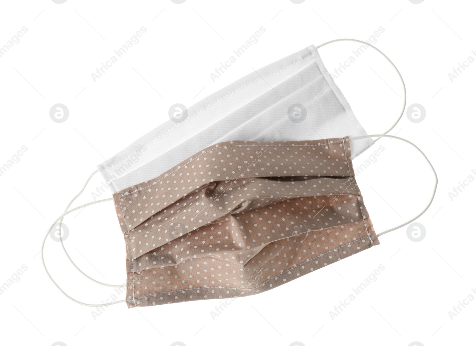 Photo of Homemade protective face masks isolated on white, top view