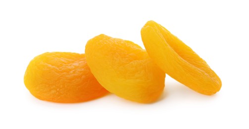 Photo of Tasty apricots on white background. Dried fruits