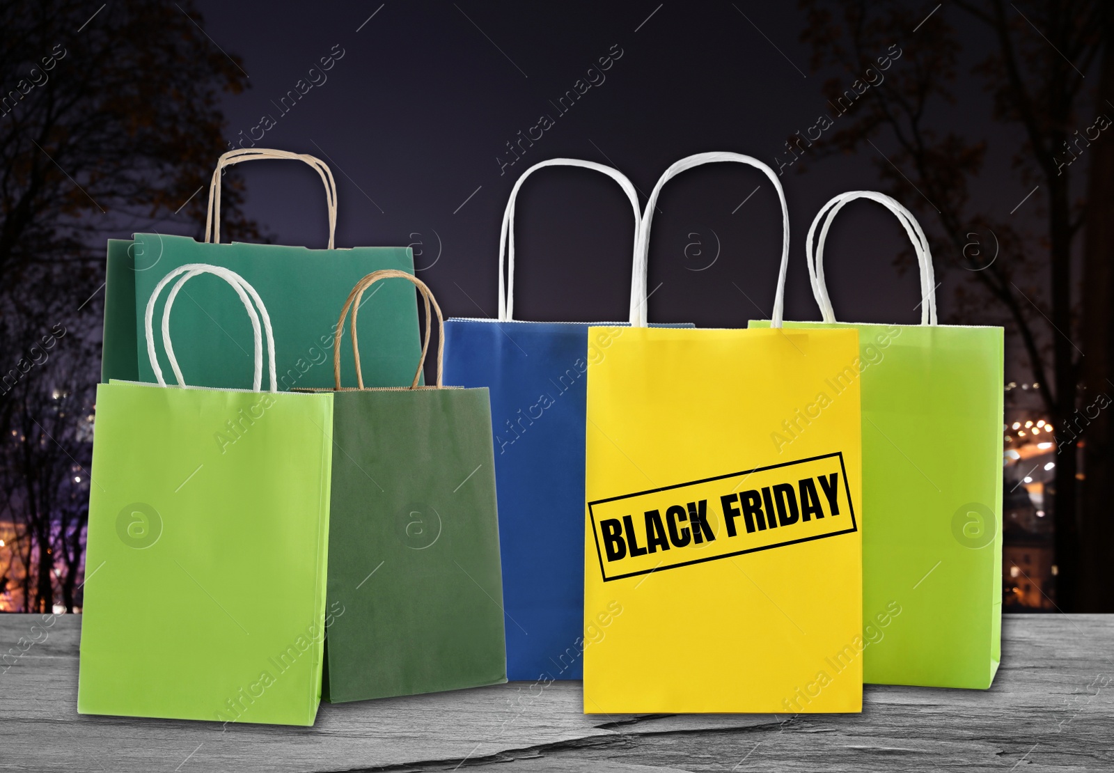 Image of Black Friday. Many shopping bags on blurred background