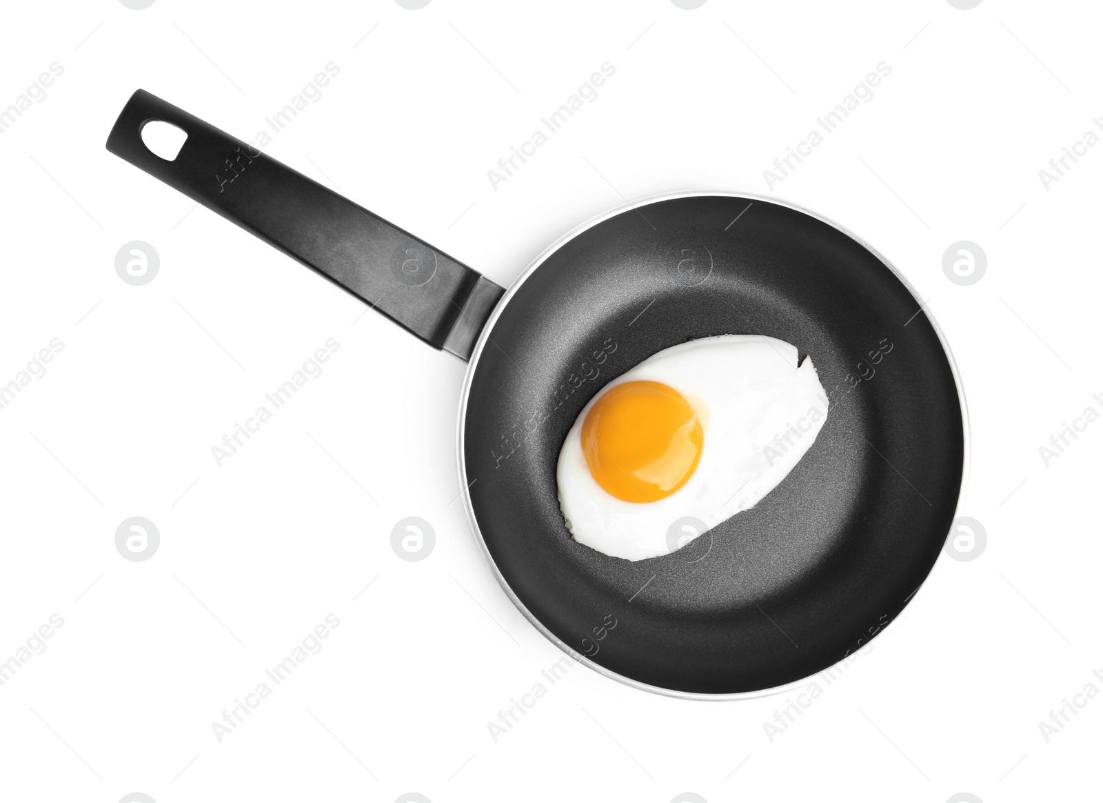 Photo of Tasty cooked egg in frying pan isolated on white, top view