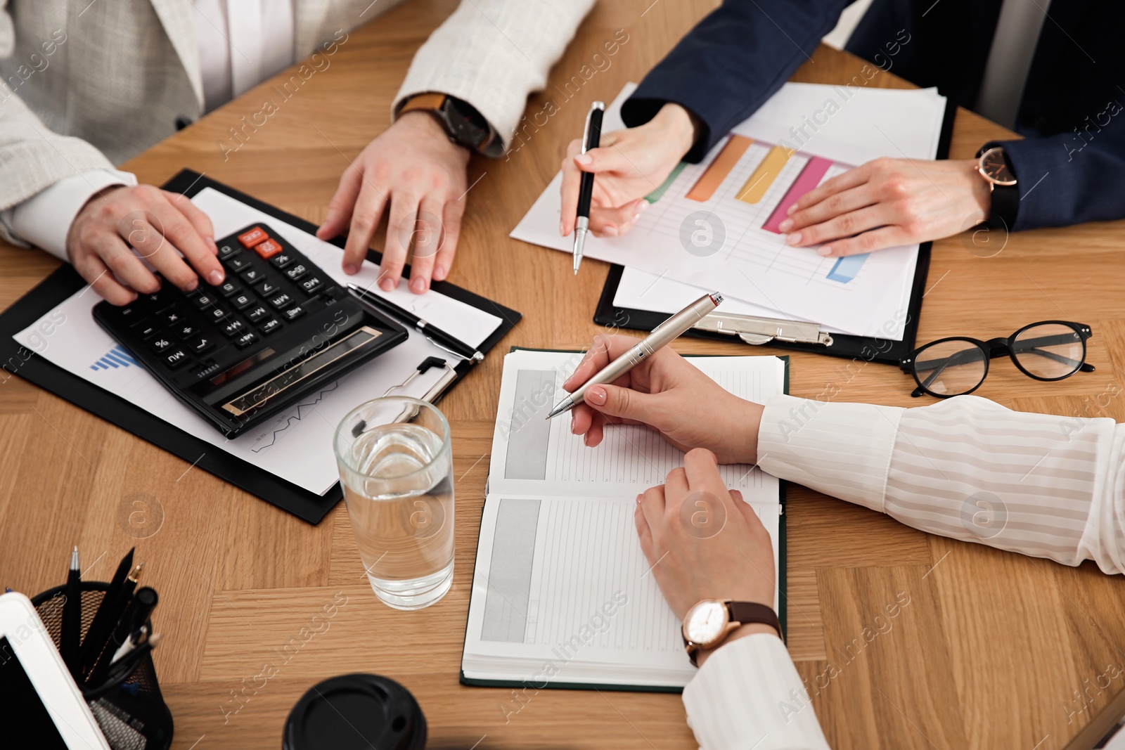 Photo of Businesspeople having meeting in office, closeup. Management consulting