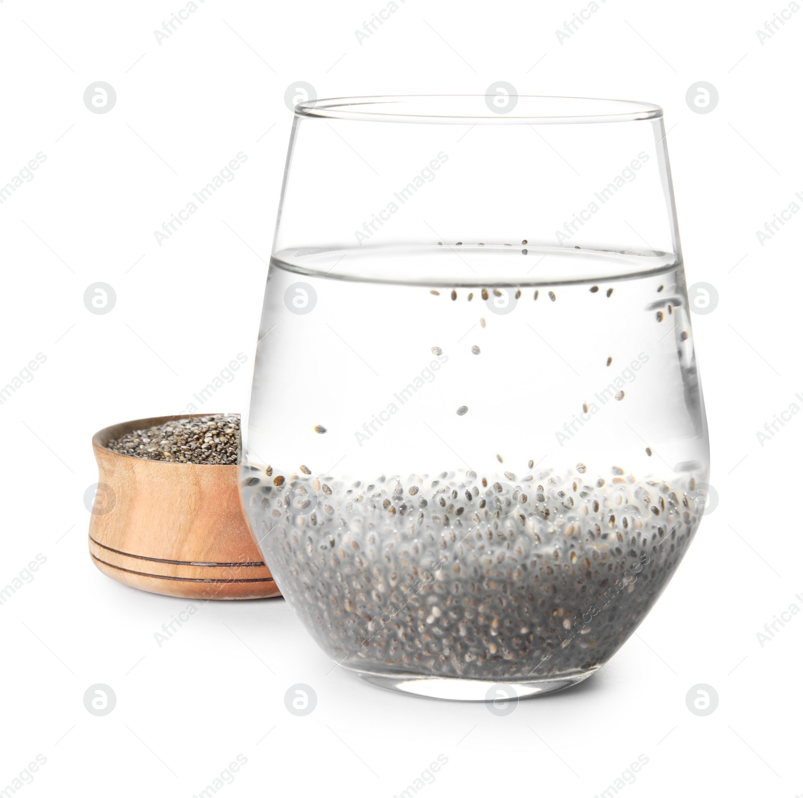 Photo of Glass of water with chia seeds and bowl on white background