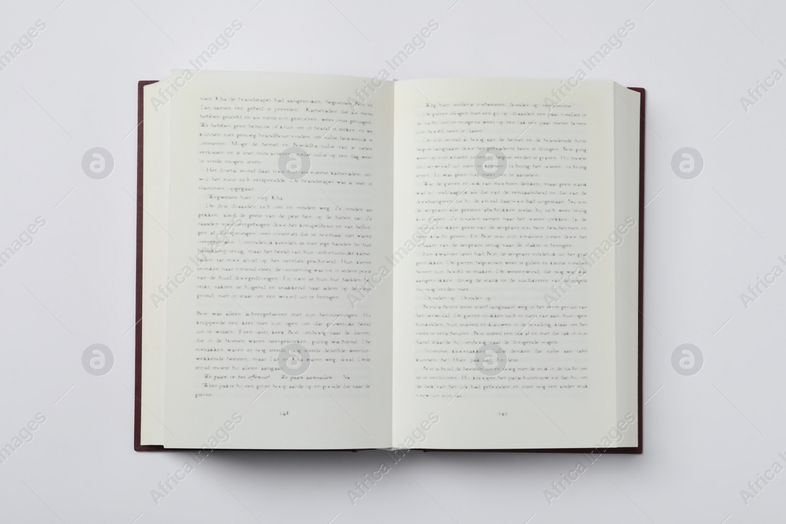 Photo of Open book on white background, top view