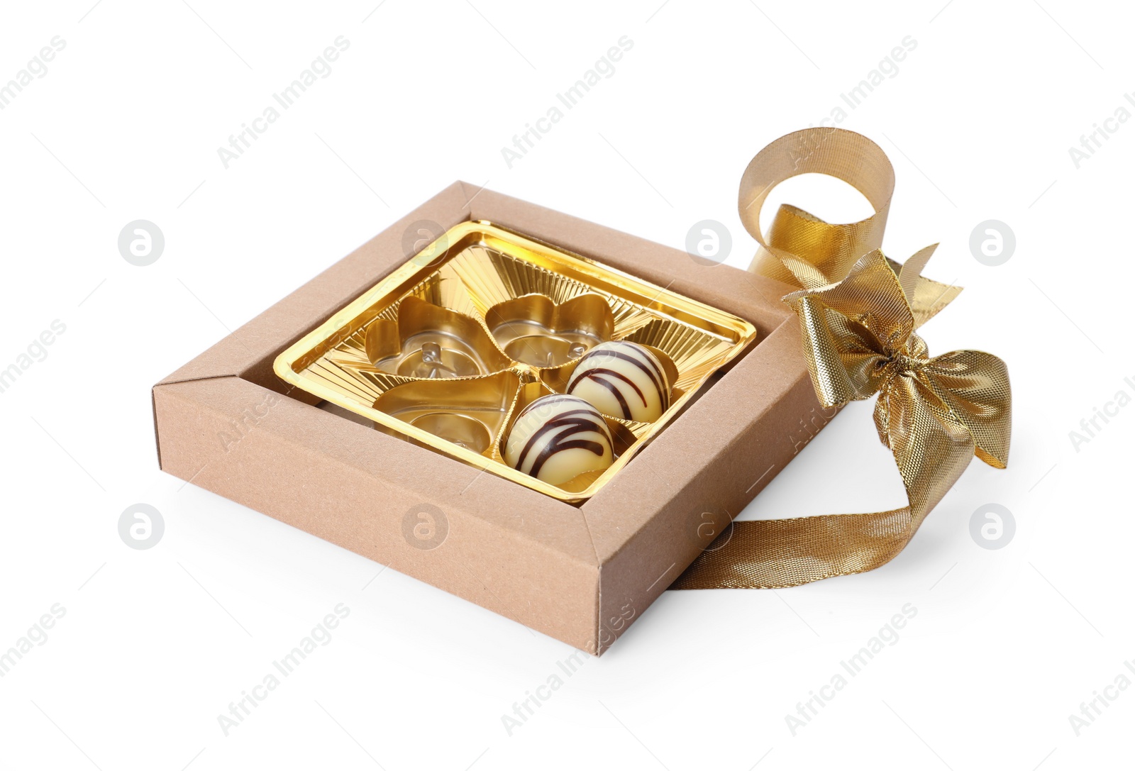 Photo of Partially empty box of chocolate candies isolated on white