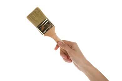 Woman holding paint brush on white background, closeup