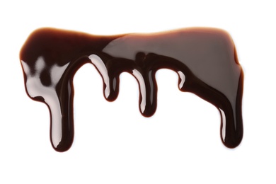 Flowing chocolate sauce on white background