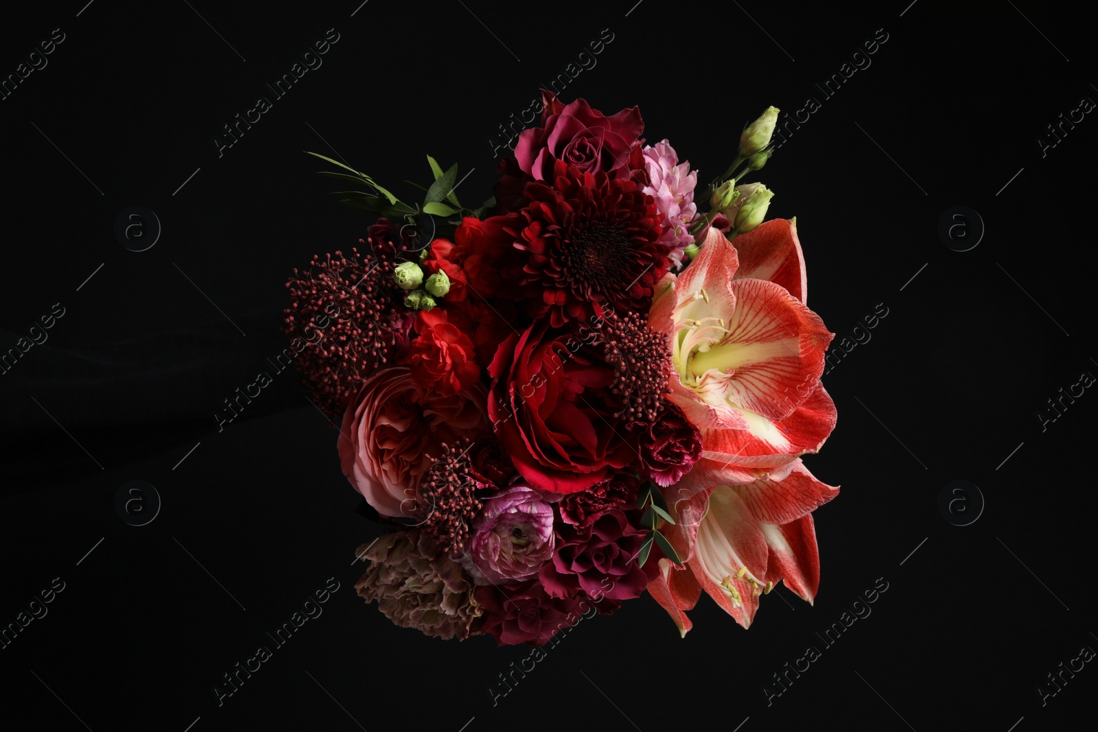 Photo of Beautiful bouquet of fresh flowers on dark background