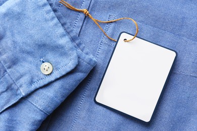 Blank tag on shirt, top view. Space for text