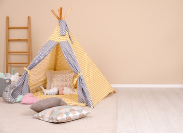 Cozy child room interior with play tent, modern decor elements and space for text