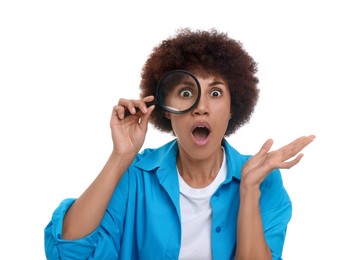 Photo of Surprised woman looking through magnifier glass on white background