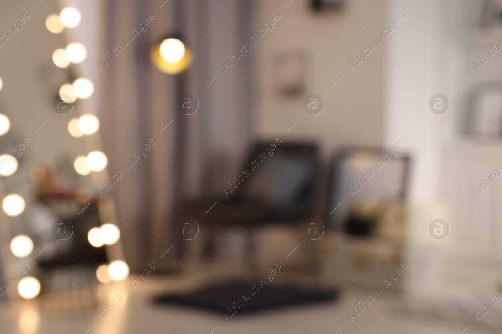 Photo of Blurred view of makeup room with stylish mirror