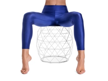 Photo of Woman with beautiful long legs wearing blue leggings on white background, closeup