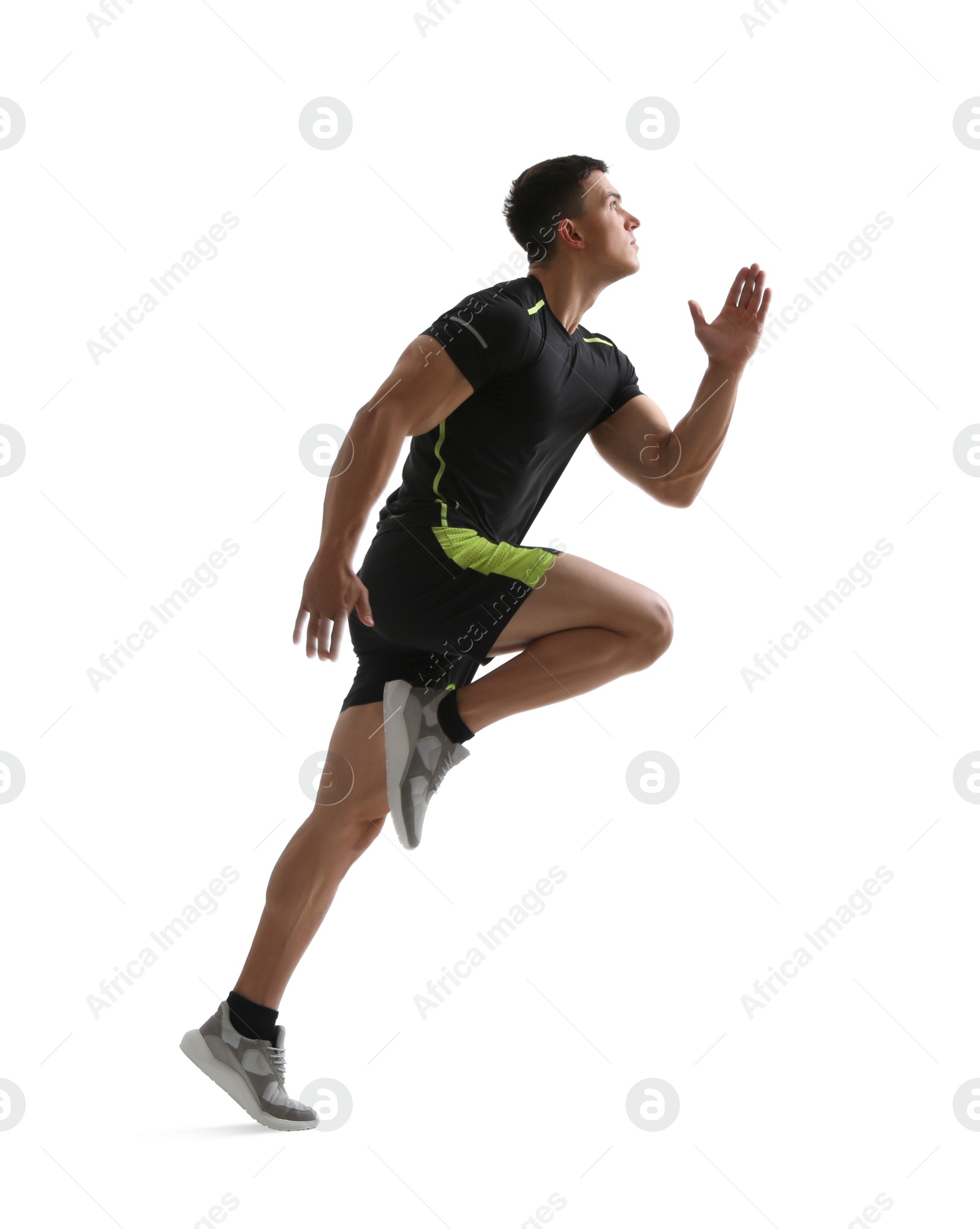 Photo of Athletic young man running on white background, side view