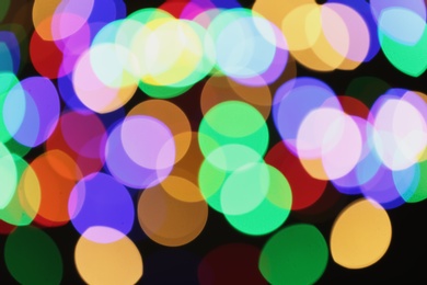 Photo of Beautiful colorful lights on dark background. Bokeh effect