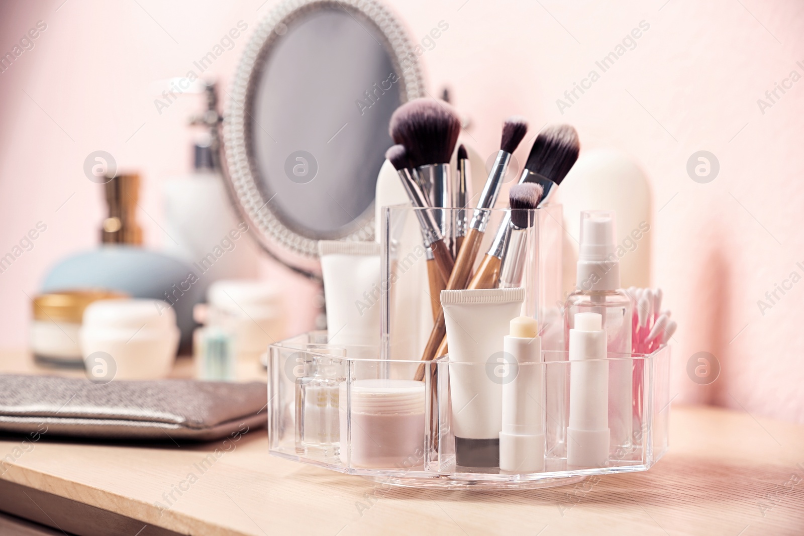 Photo of Set of body care cosmetic products on dressing table. Space for text