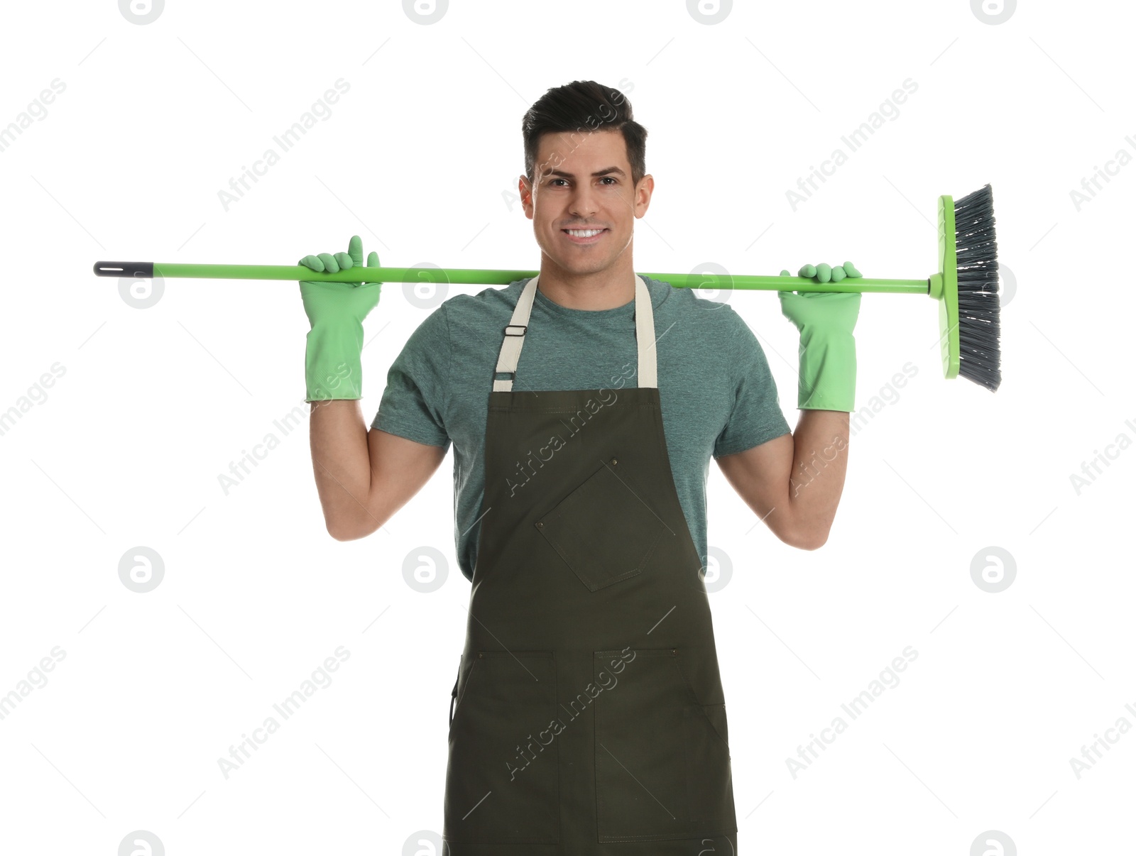 Photo of Man with green broom on white background