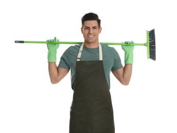 Photo of Man with green broom on white background