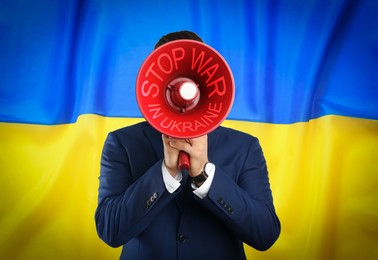 Image of Stop war in Ukraine. Man in suit with megaphone against Ukrainian national flag