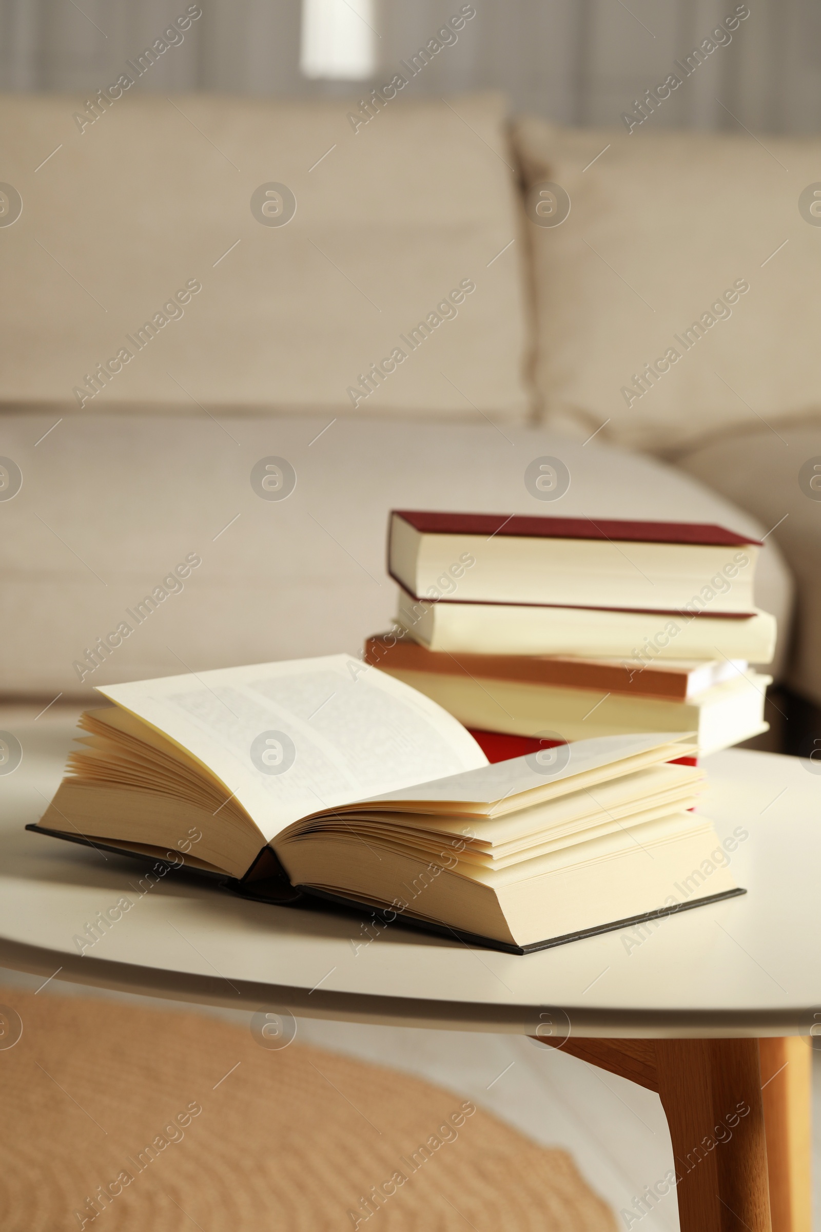 Photo of Many different books on white table indoors