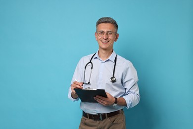 Doctor with stethoscope and clipboard on light blue background
