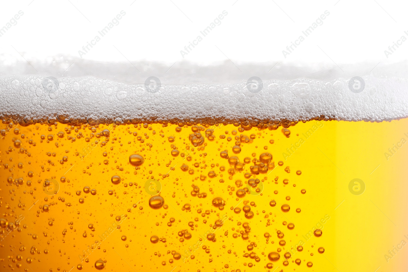 Photo of Tasty beer with foam in glass, closeup