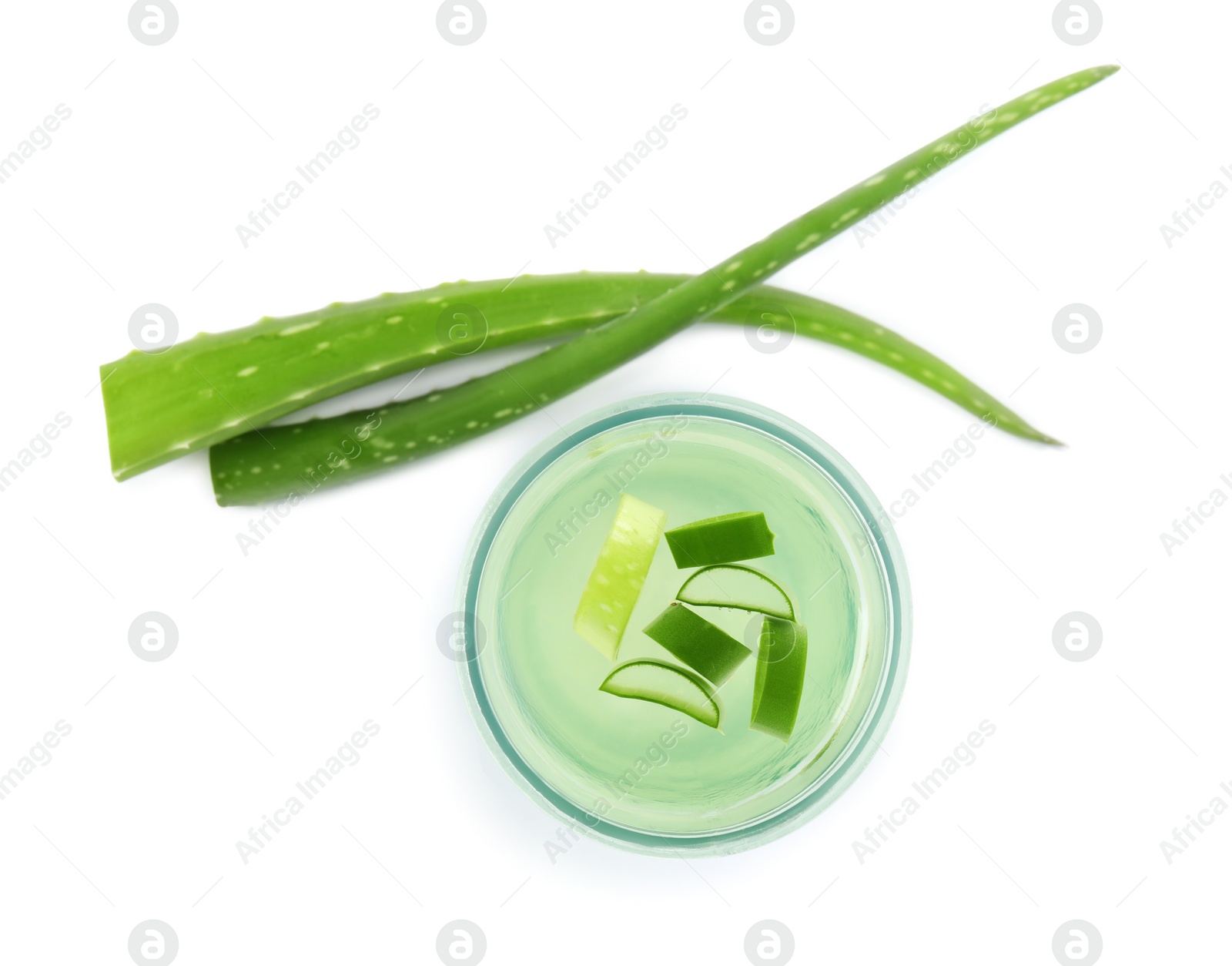 Photo of Fresh aloe drink in glass and leaves on white background, top view