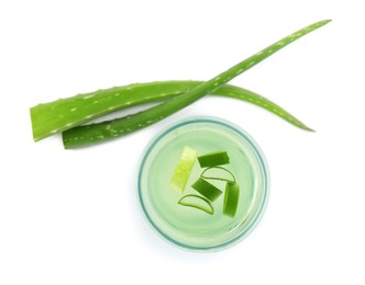 Photo of Fresh aloe drink in glass and leaves on white background, top view