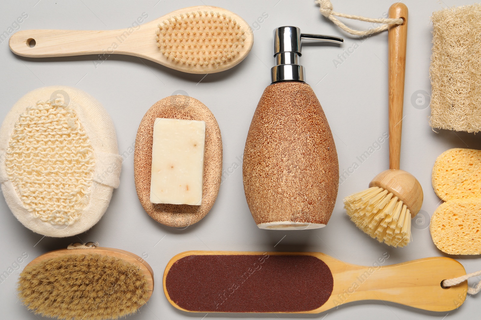 Photo of Bath accessories. Flat lay composition with personal care tools on light grey background