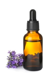 Photo of Bottle of essential oil and lavender flowers isolated on white
